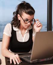 girl in glasses at computer